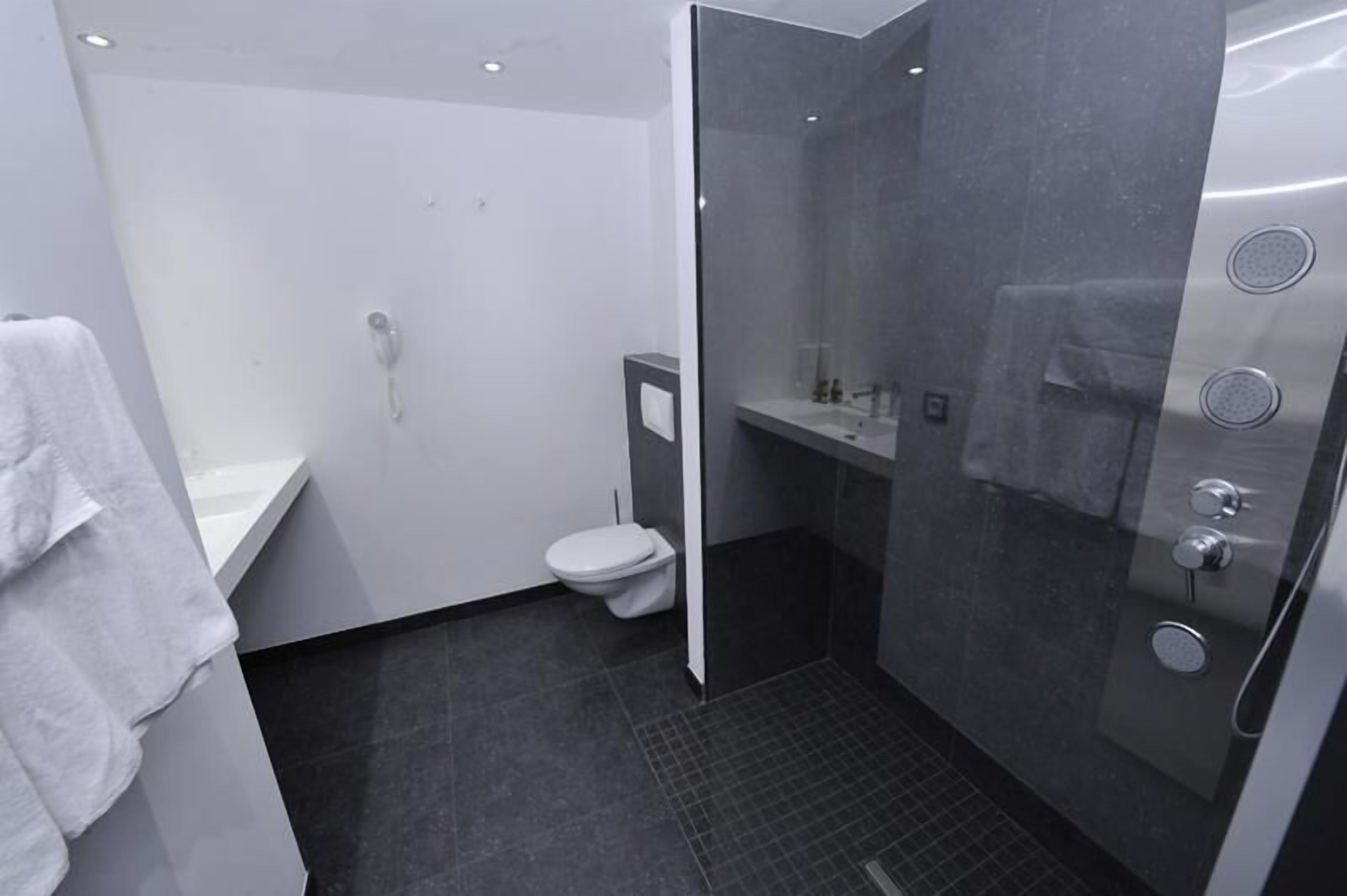 superior triple room, lake view | bathroom | designer toiletries, hair dryer, towels