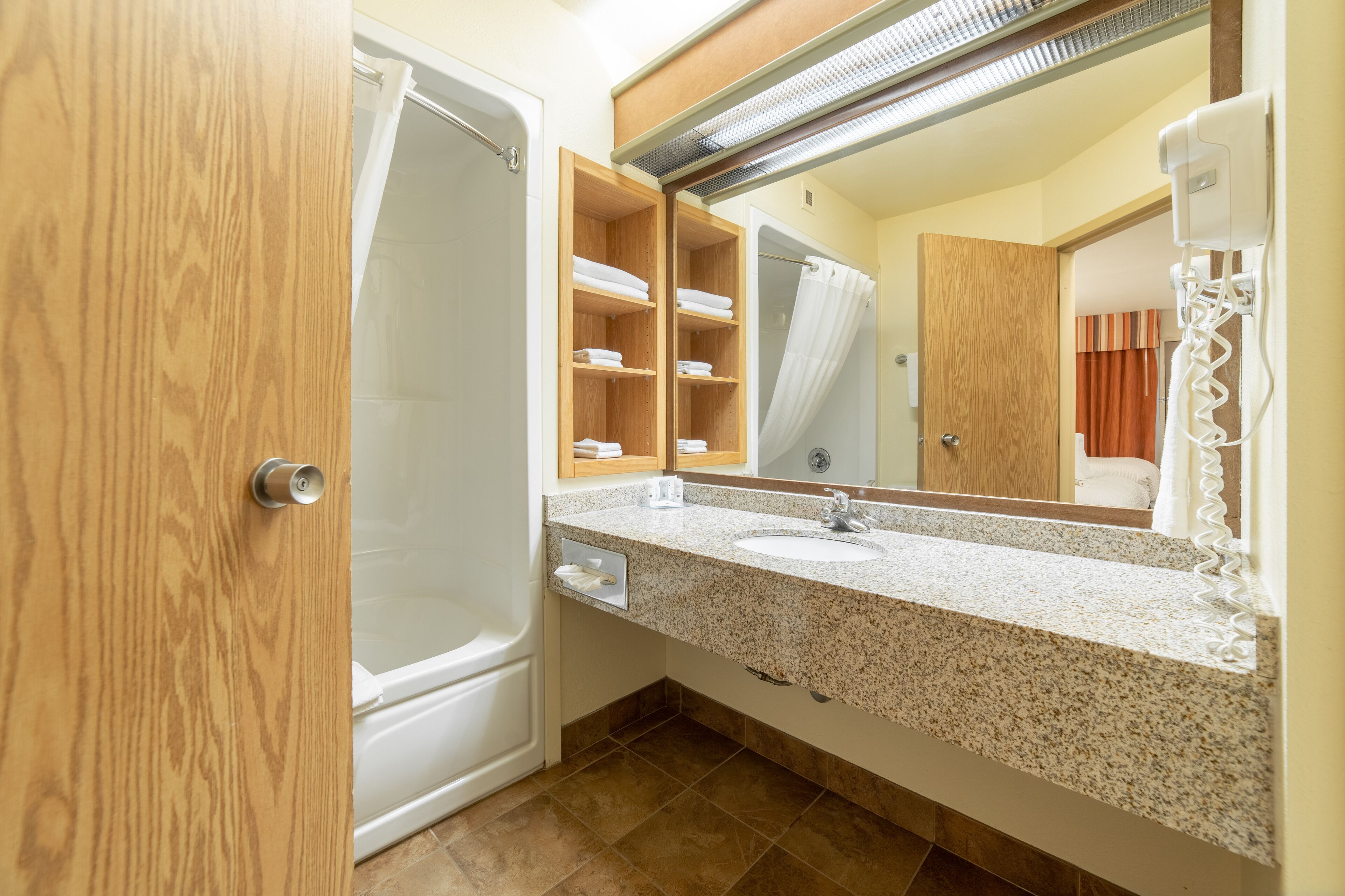 standard room, 2 queen beds, poolside | bathroom | hair dryer, towels