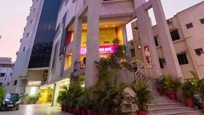 A modern building with a unique architectural design, featuring a prominent staircase and multiple levels. - Ginger Chennai Vadapalani (Chennai)