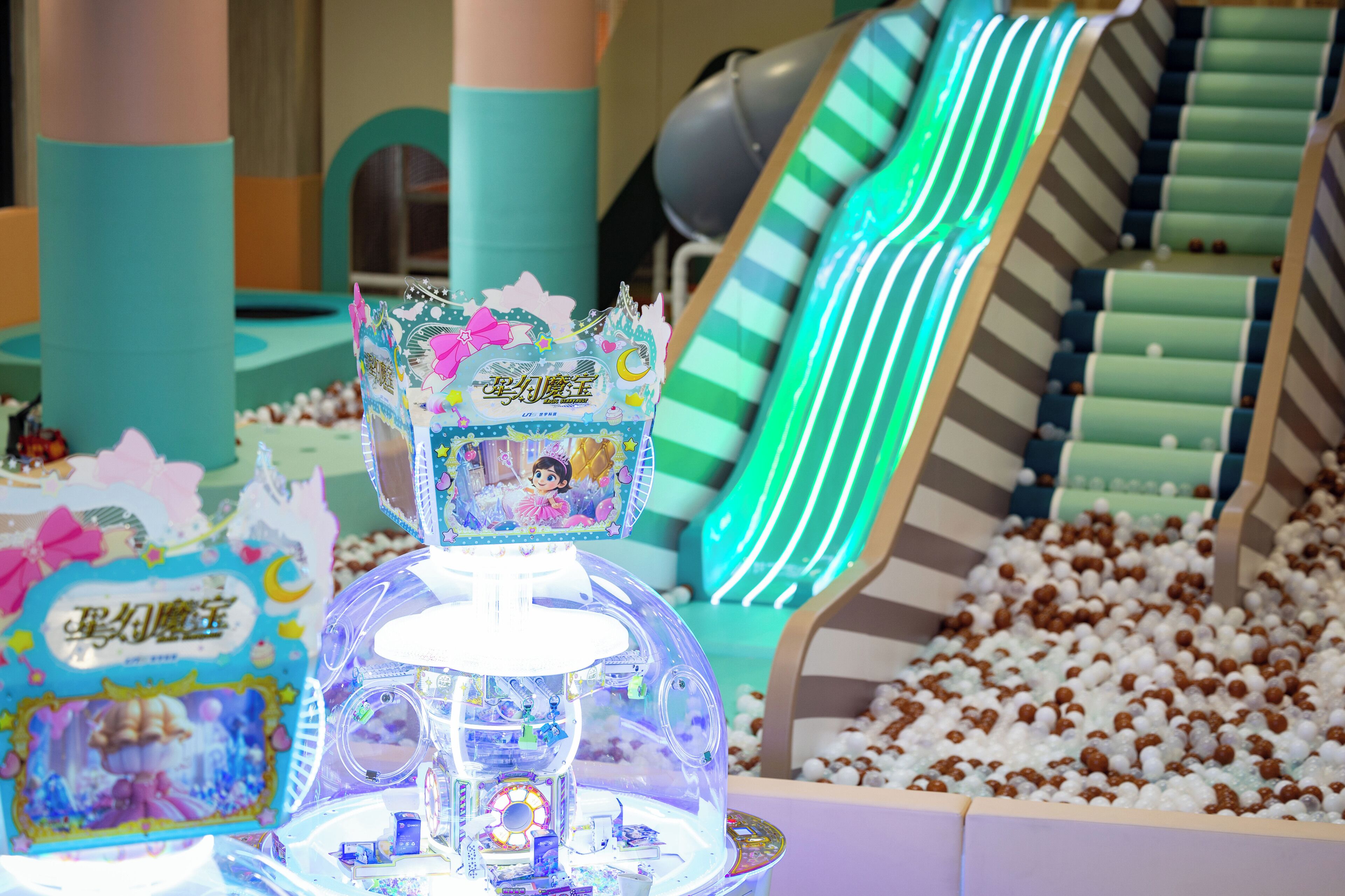 A children's play area with a ball pit, a slide, and a castle-themed play structure.