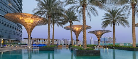 Outdoor pool, open 6:30 AM to 8:30 PM, pool umbrellas, pool loungers