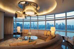 Presidential Suite | Living area | 55-inch flat-screen TV with satellite channels, TV, DVD player