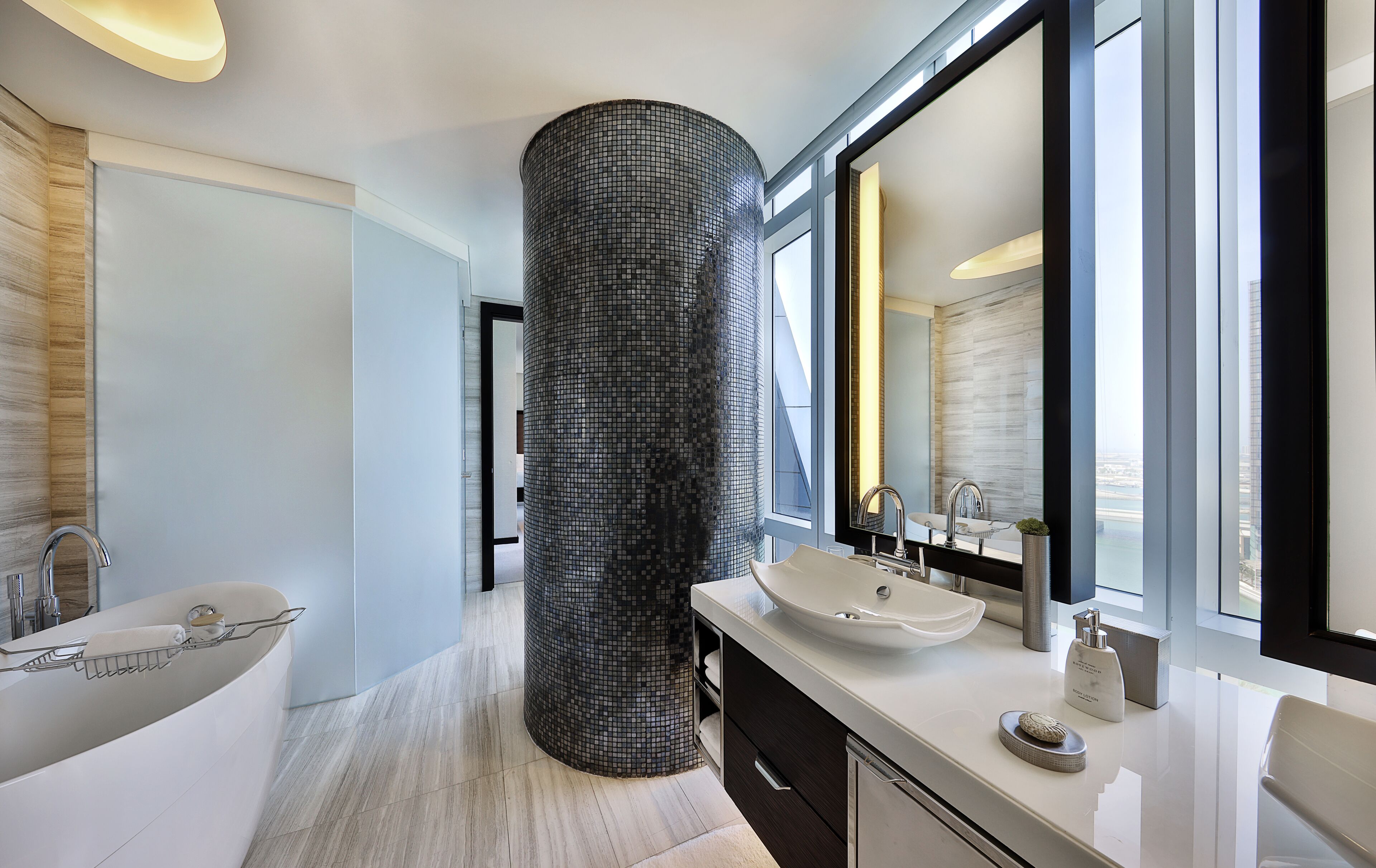 premier suite (skyline view) | bathroom | separate bathtub and shower, free toiletries, hair dryer, bathrobes