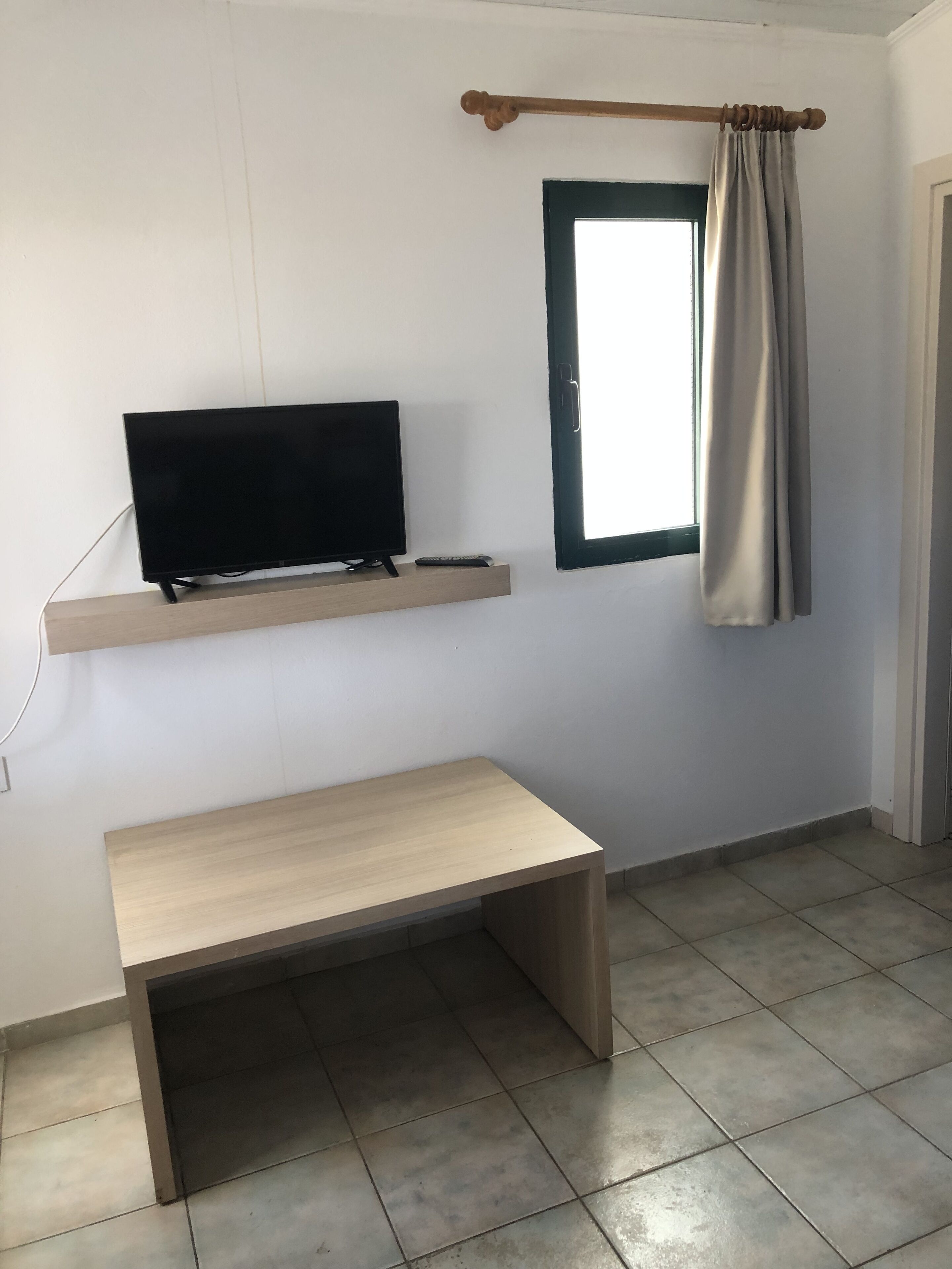 two-bedroom apartment ground level | television