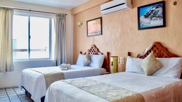Suíte estúdio júnior, 2 camas de casal | Cofres nos quartos, Wi-Fi de cortesia, roupa de cama