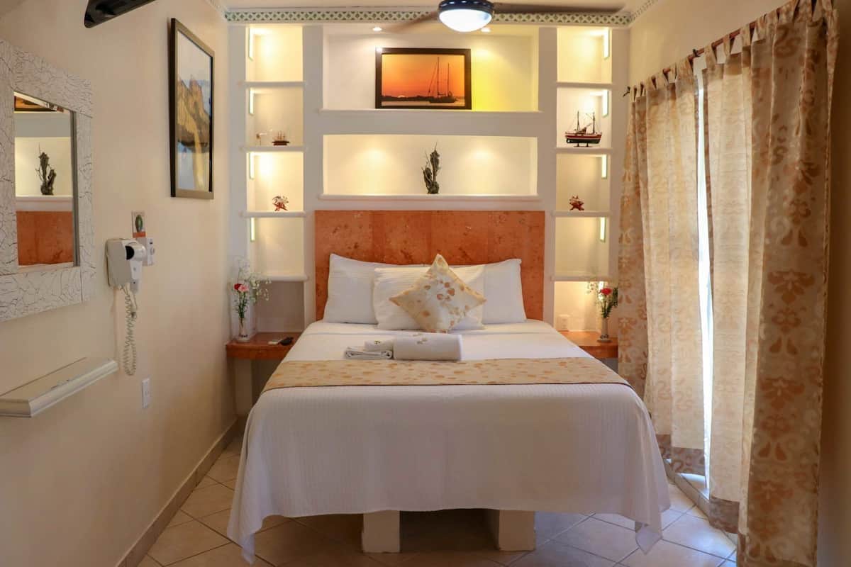 Suite monolocale Junior, angolo cottura | Una cassaforte in camera, Wi-Fi gratuito, lenzuola