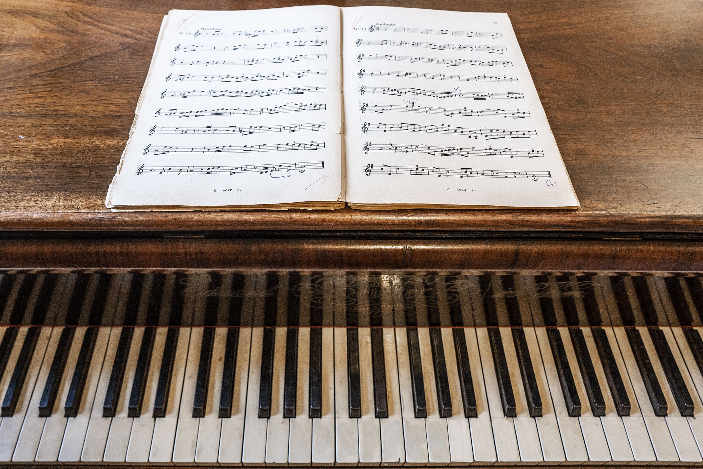 An open music sheet on a piano.
