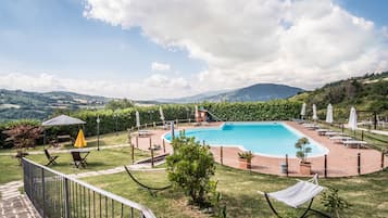 Outdoor pool, pool umbrellas, sun loungers