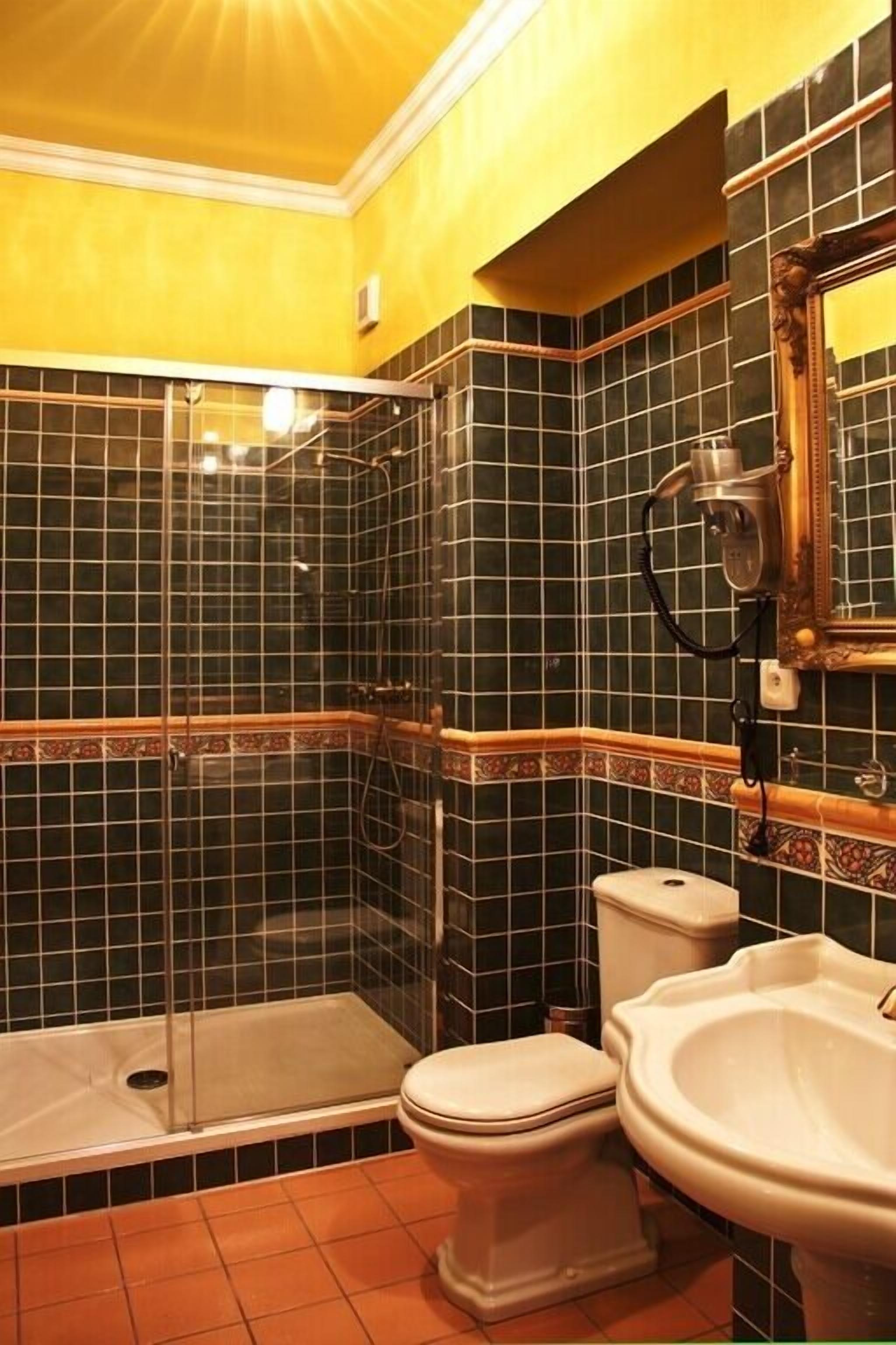 shower, designer toiletries, hair dryer, towels