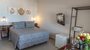 Quarto superior, vista para a praia | Frigobar, cofres nos quartos, Wi-Fi de cortesia, roupa de cama