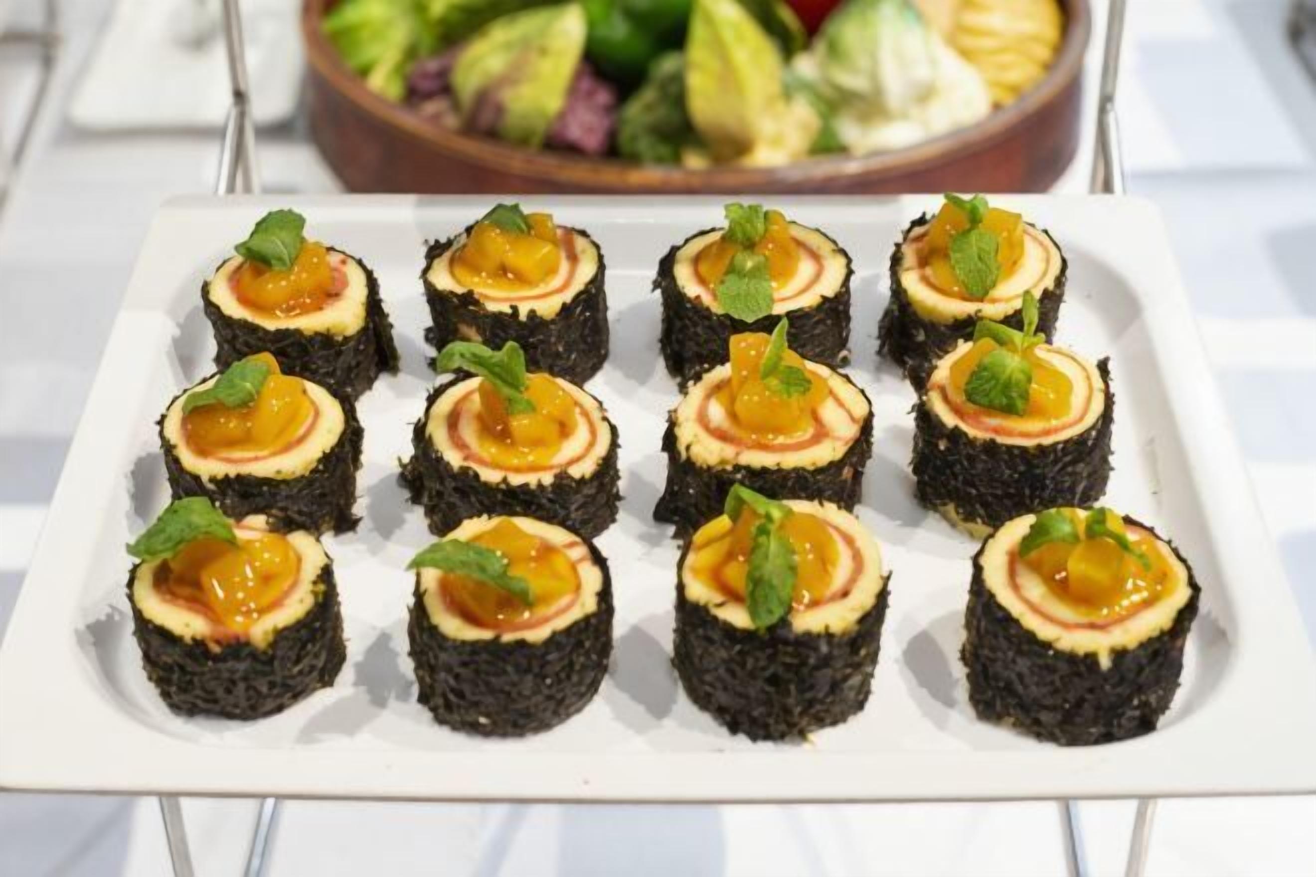 A white rectangular plate with food items arranged in a grid.