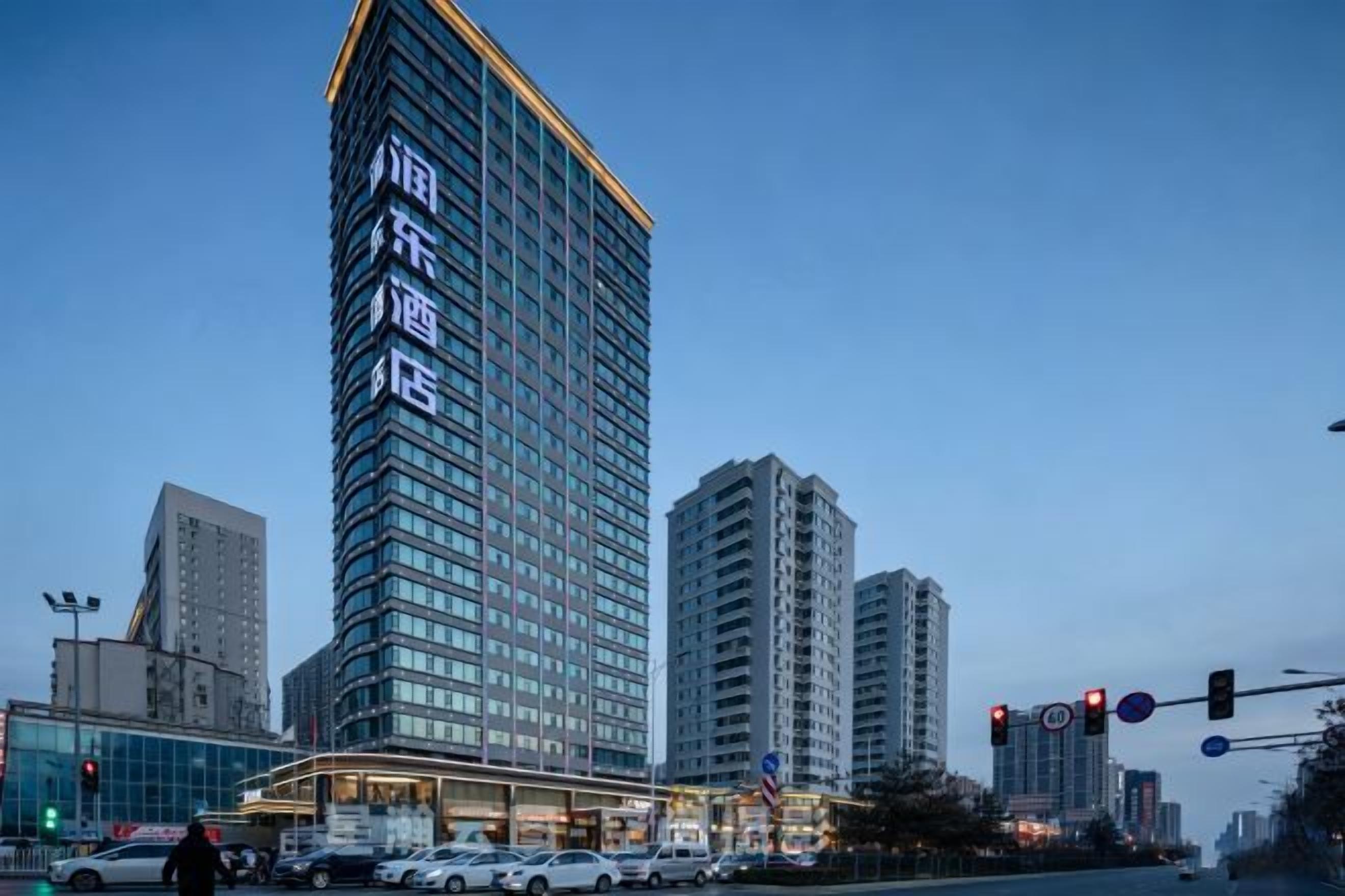 A high-rise hotel with a prominent entrance and multiple floors.