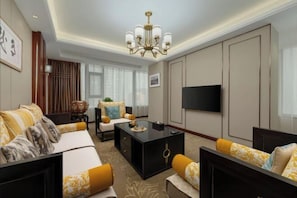 A modern hotel room with a sofa, a coffee table, a TV, and a large window with curtains. - Ready Hotel (Taiyuan)