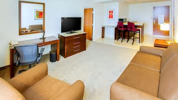 King Bed Bedroom Suite | Living area | 42-inch plasma TV with cable channels, TV, MP3 dock