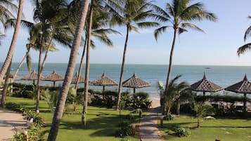 On the beach, sun loungers, beach umbrellas