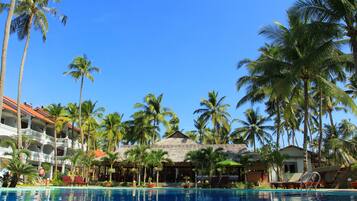 Outdoor pool, a waterfall pool, pool umbrellas, sun loungers