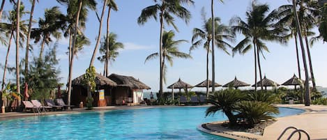 Outdoor pool, a waterfall pool, pool umbrellas, pool loungers