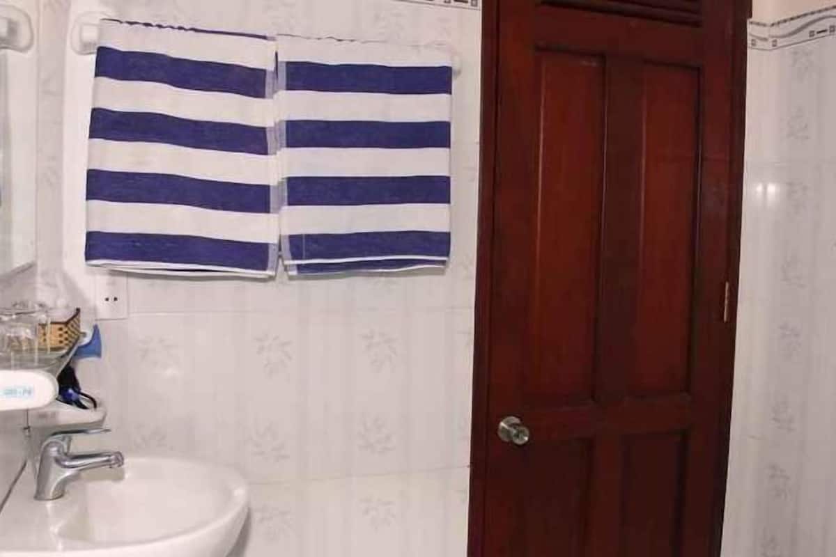 Bathroom | Shower, free toiletries, slippers, soap