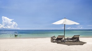 On the beach, white sand, free beach cabanas, sun loungers
