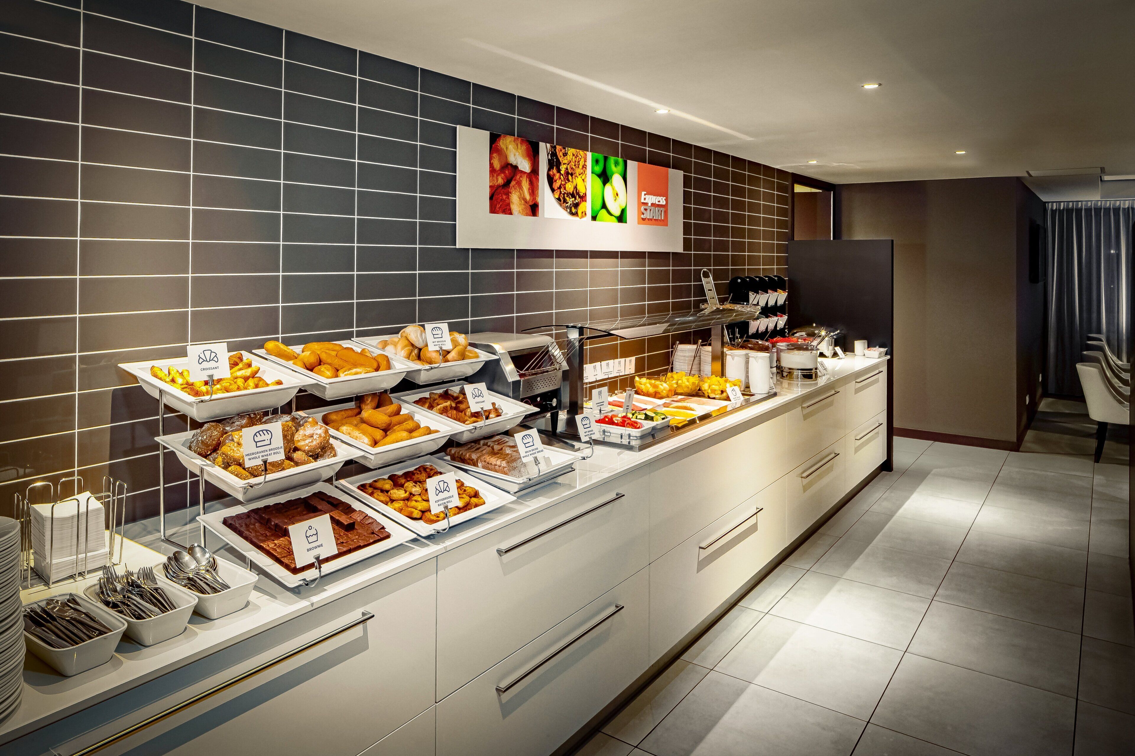A buffet with various food items and a sign indicating 'Express Start'.
