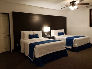 Premium Suite, Multiple Beds | Premium bedding, in-room safe, desk, blackout curtains