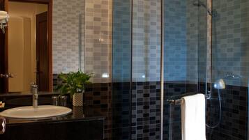 Deep soaking tub, designer toiletries, hair dryer, slippers