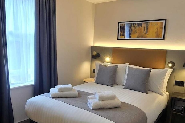 Standard Double Room | In-room safe, desk, laptop workspace, blackout drapes