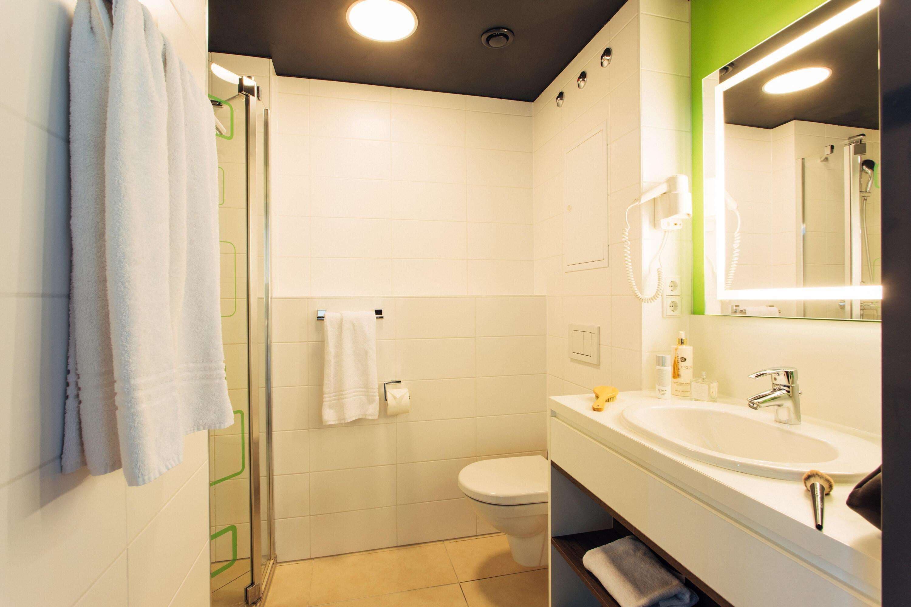 eco-friendly toiletries, hair dryer, towels, soap