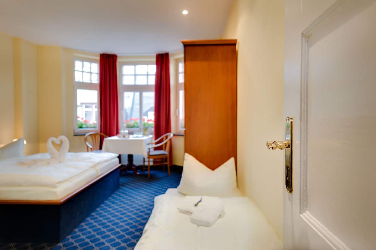 Triple Room | Living area | Flat-screen TV