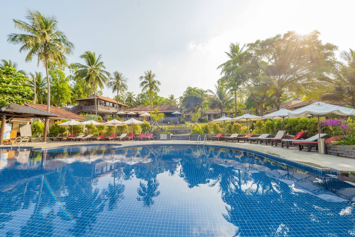 outdoor pool, pool umbrellas, pool loungers