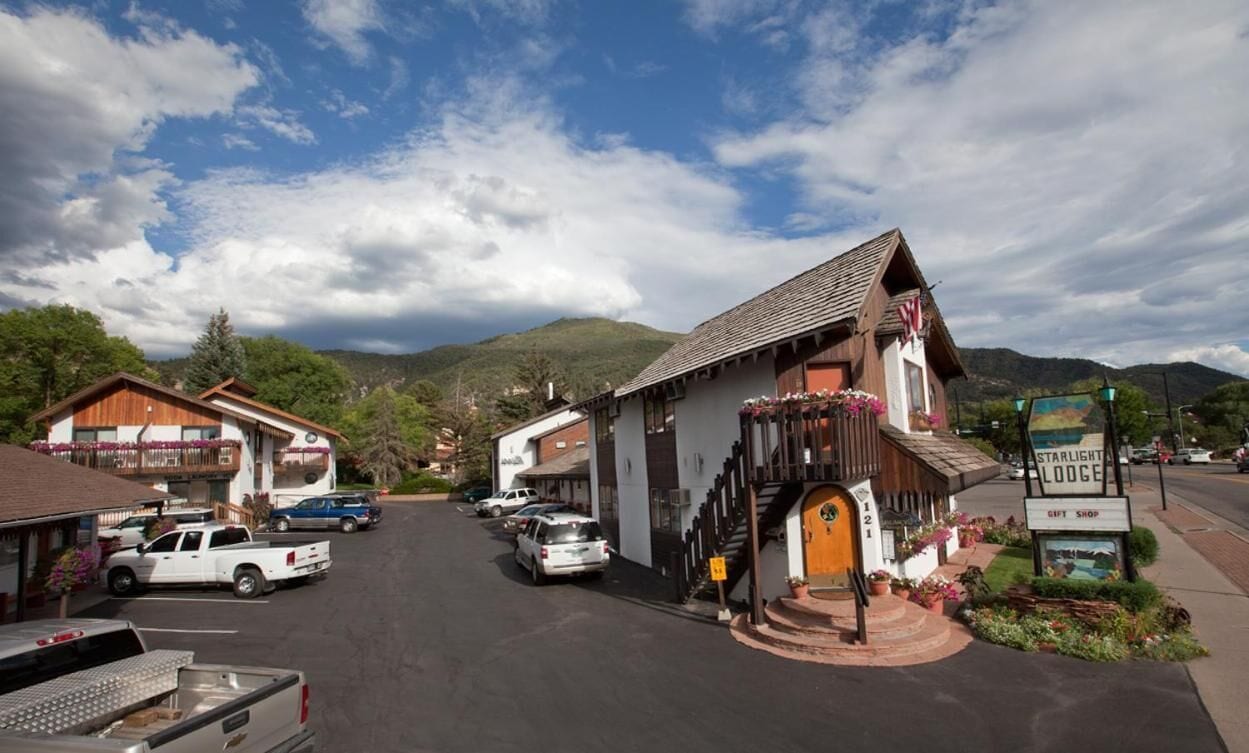 A small-town street with a building labeled "Starlight Lodge" and a gift shop.