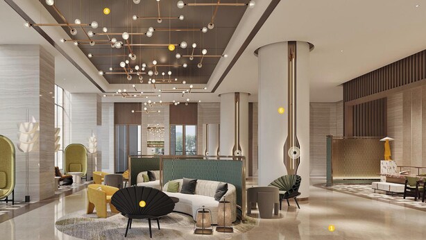 A spacious lobby with a modern chandelier, a central seating area, and a large window providing natural light. - Holiday Inn Hefei City Center by IHG (Hefei)