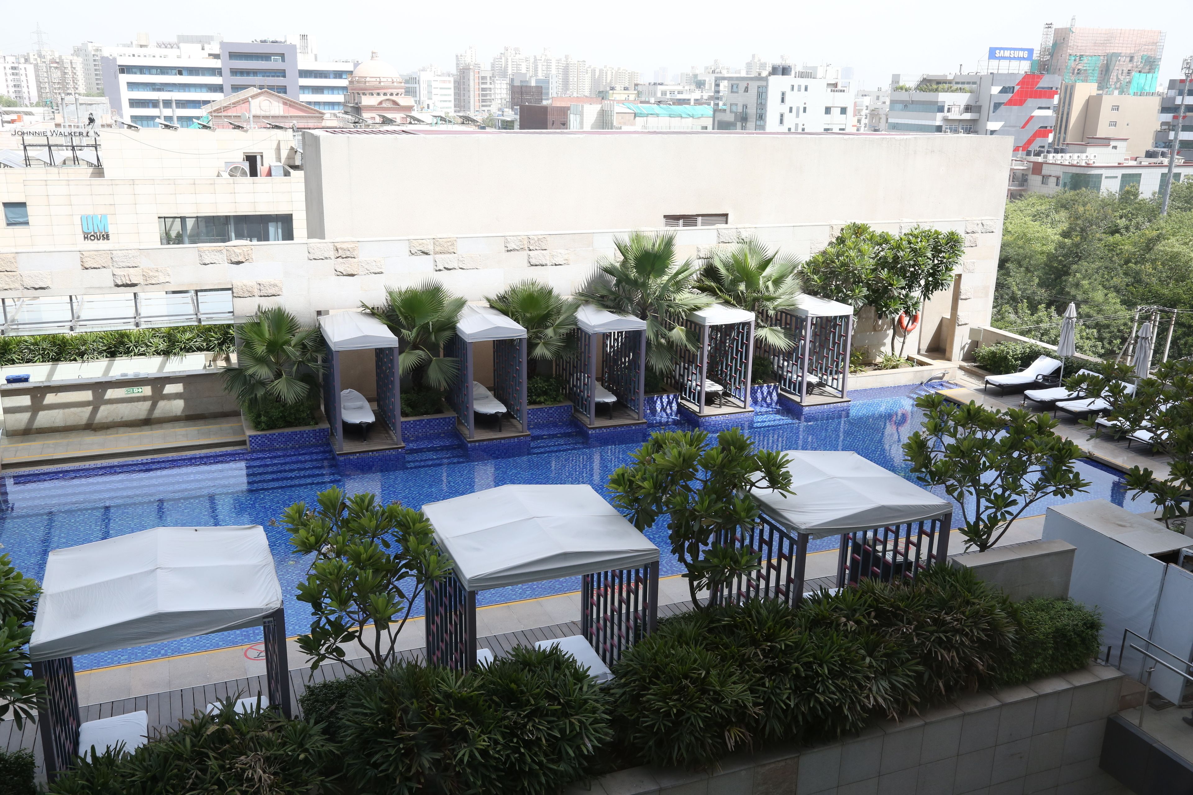 outdoor pool, open 7:00 am to 8:00 pm, pool umbrellas, pool loungers