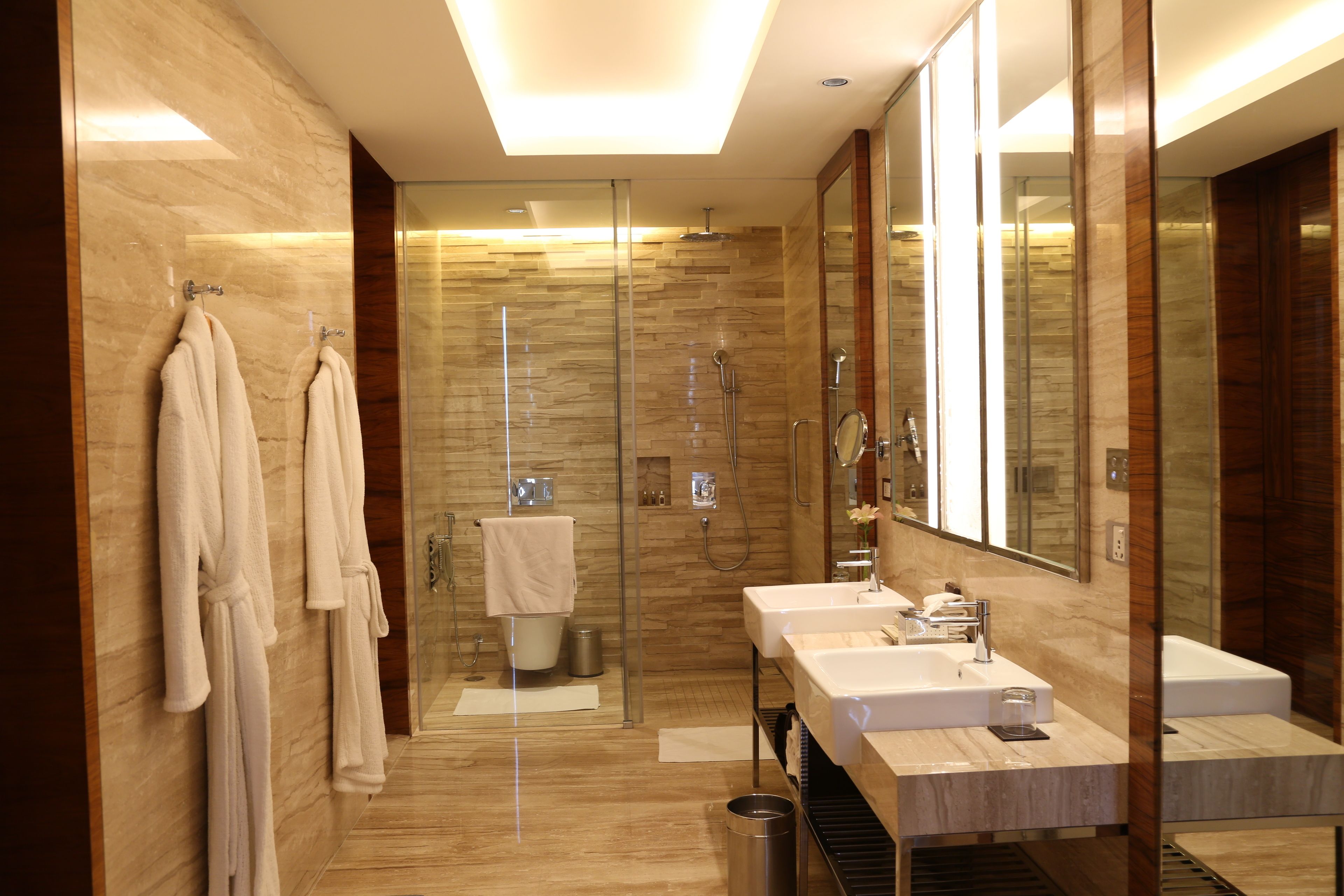 separate bathtub and shower, rainfall showerhead, designer toiletries