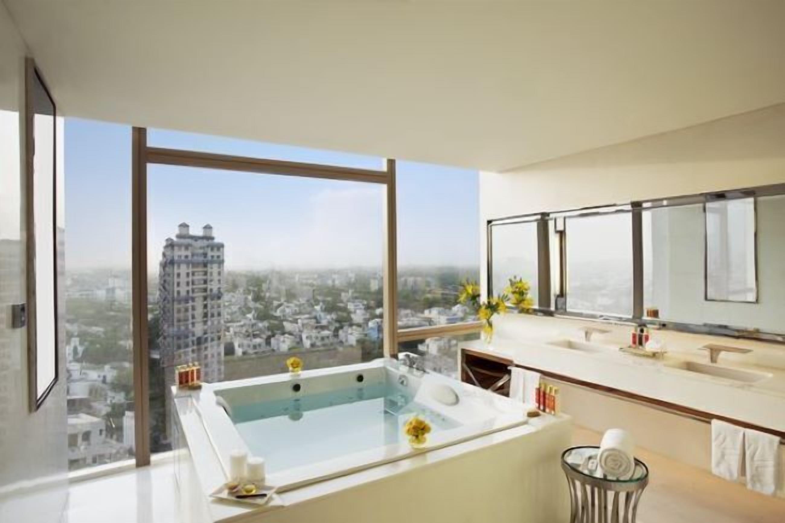 separate bathtub and shower, rainfall showerhead, designer toiletries