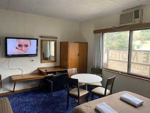 Family Room | Premium bedding, blackout drapes, iron/ironing board, free WiFi
