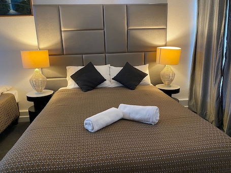 Premium bedding, blackout drapes, iron/ironing board, free WiFi