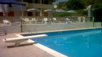 Outdoor pool, pool umbrellas, pool loungers