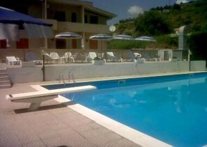 Outdoor pool, pool umbrellas, pool loungers