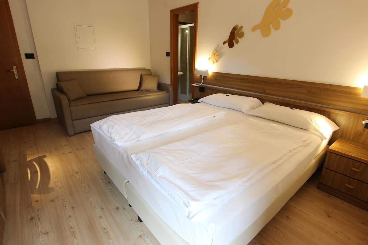 Family Room | Hypo-allergenic bedding, down duvets, in-room safe, desk