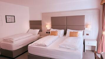 Triple Room | Hypo-allergenic bedding, down comforters, in-room safe, desk