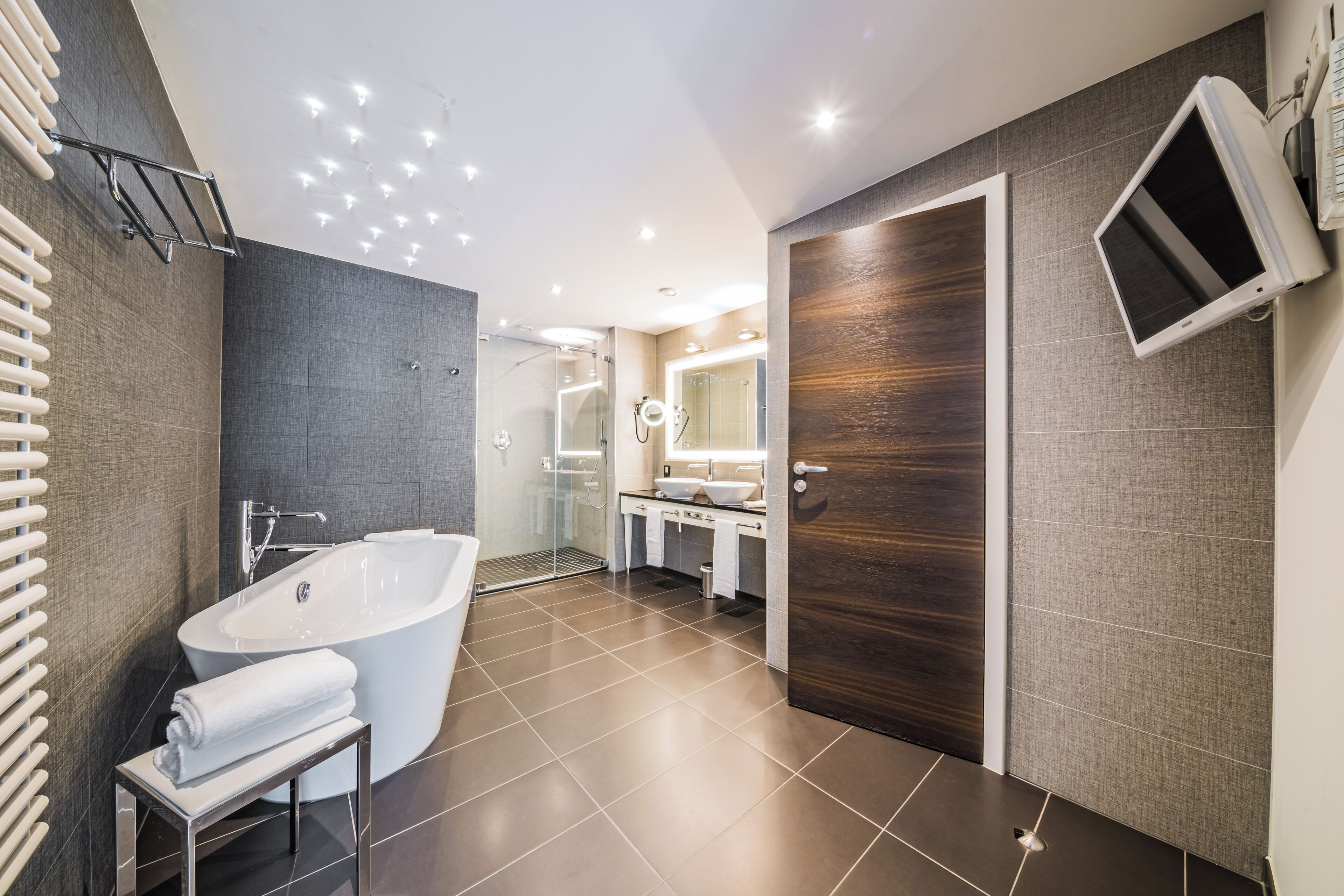junior suite | bathroom | designer toiletries, hair dryer, bathrobes, towels