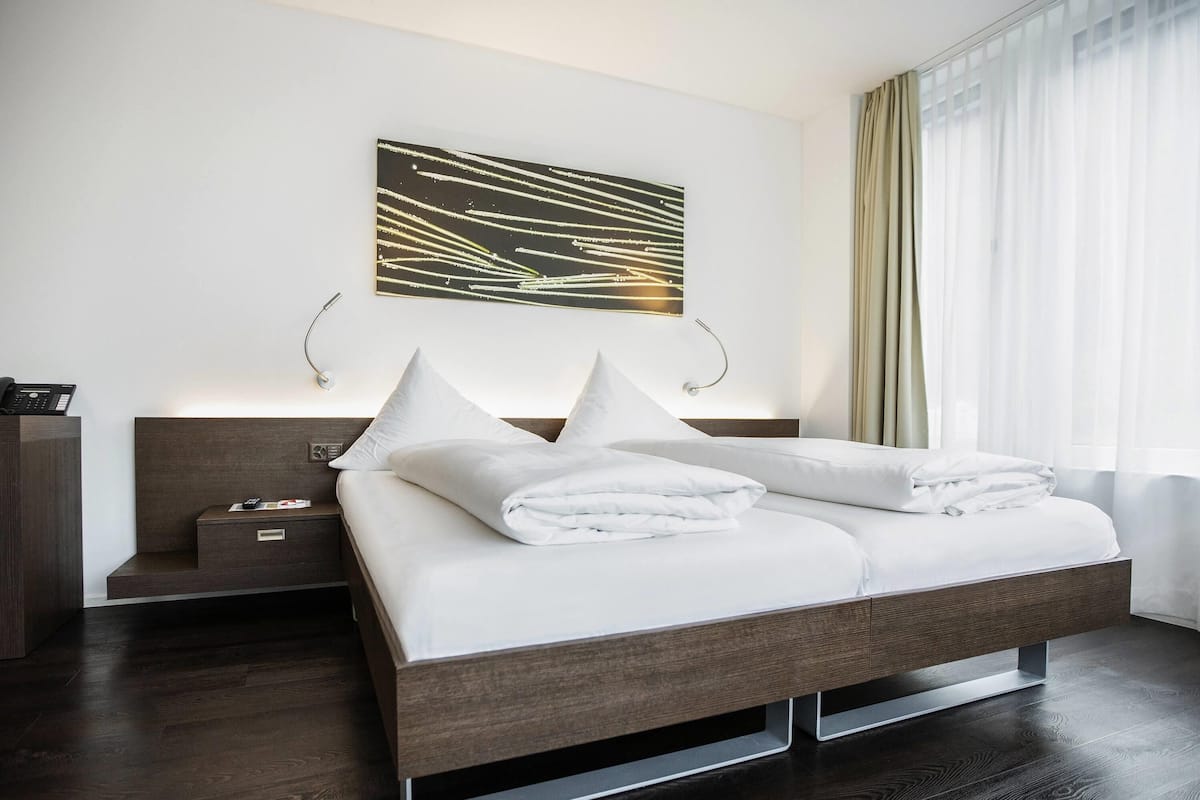 Premium bedding, down duvets, pillow-top beds, free minibar