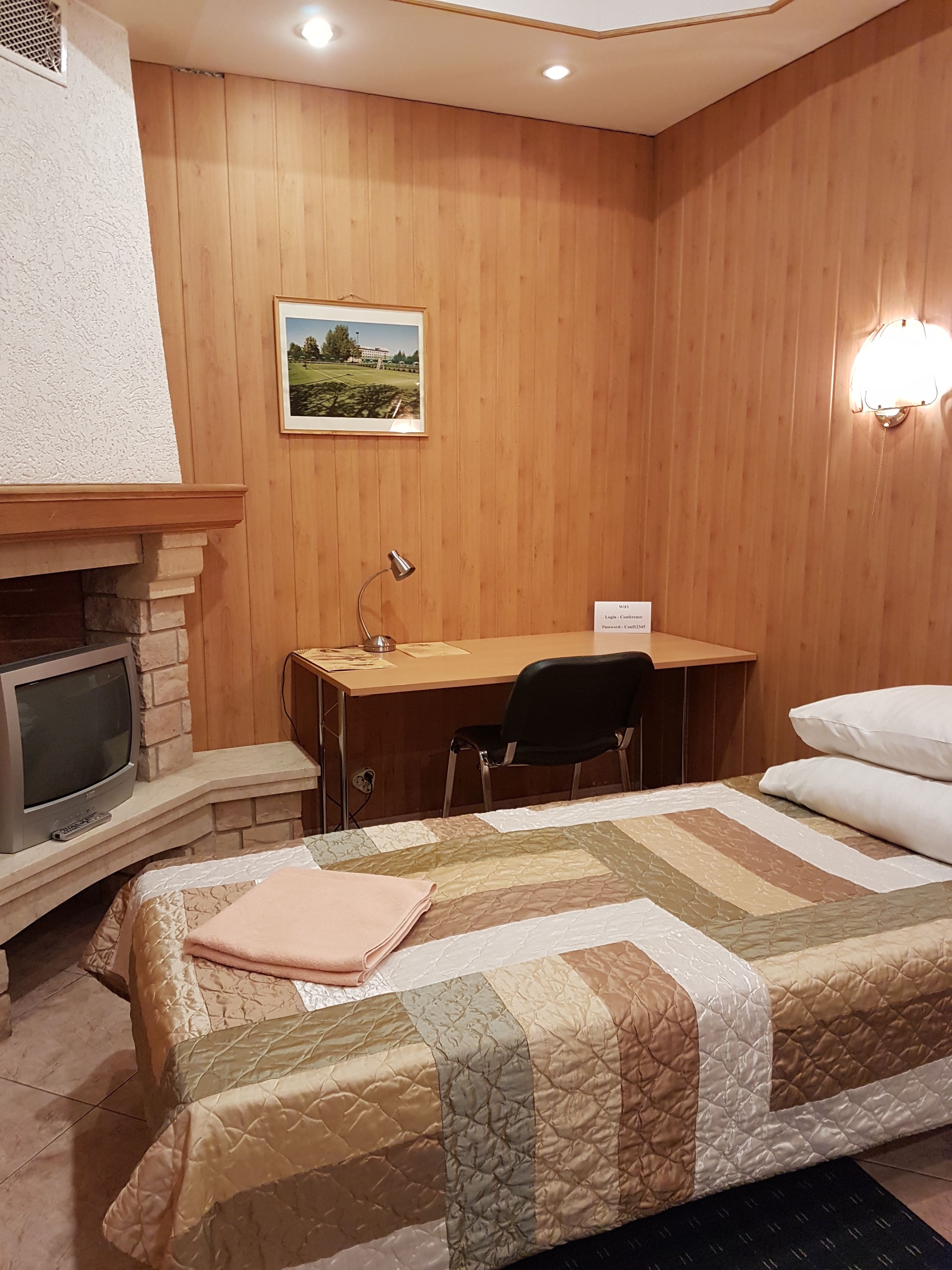 economy room, shared bathroom | premium bedding, desk, soundproofing, iron/ironing board