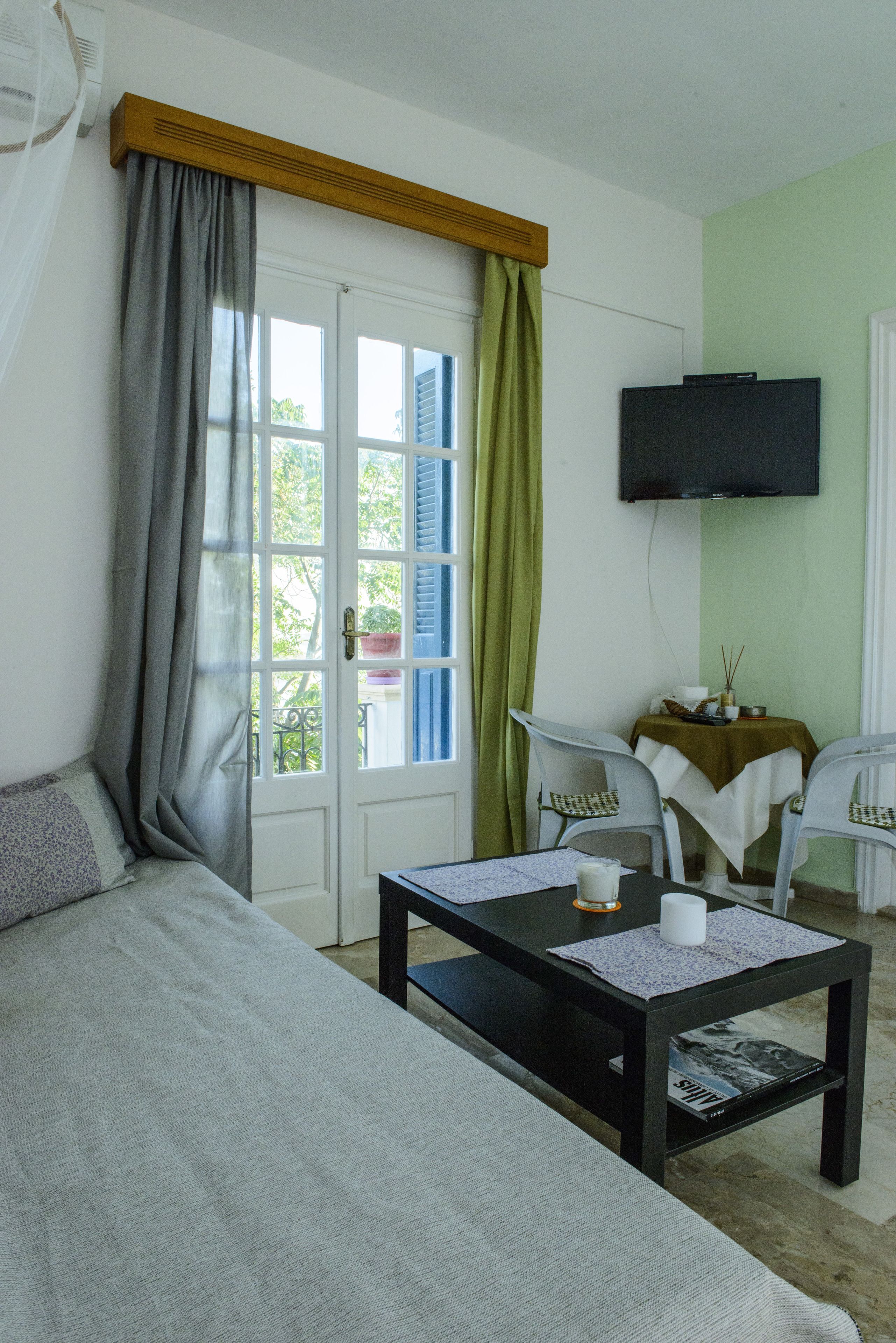 two bedroom studio for 2 adults and 2 children (sea view) | living area | 22-inch lcd tv with satellite channels, tv