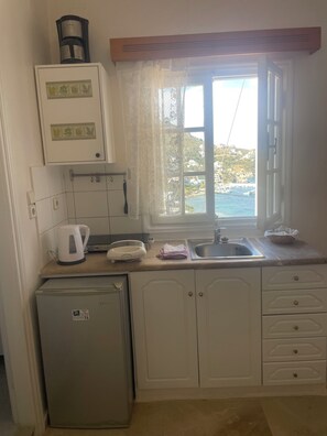 Honeymoon Studio Suite, Non Smoking, Sea View (Top Floor) | Private kitchen | Fridge, stovetop, coffee/tea maker, electric kettle - Melina's sunset (Kalymnos)