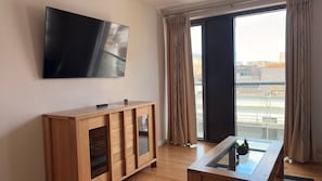 One Bedroom Apartment – Town View Deluxe | Living area | 55-inch TV with digital channels - Liberty Wharf Apartments (St. Helier)
