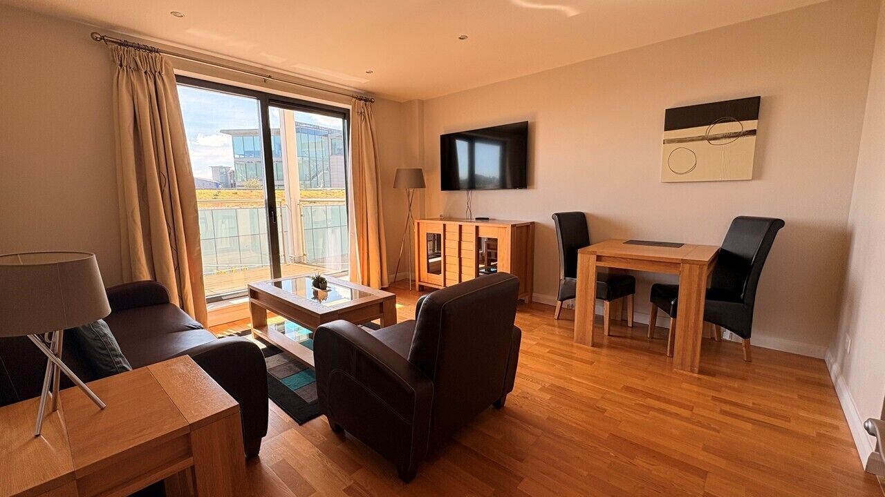 Apartment, Balcony | Living area | 55-inch TV with digital channels