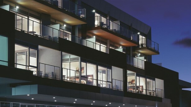 A multi-story hotel with balconies, large windows, and a modern architectural design. - St Kilda Central Apartment Hotel (St Kilda)