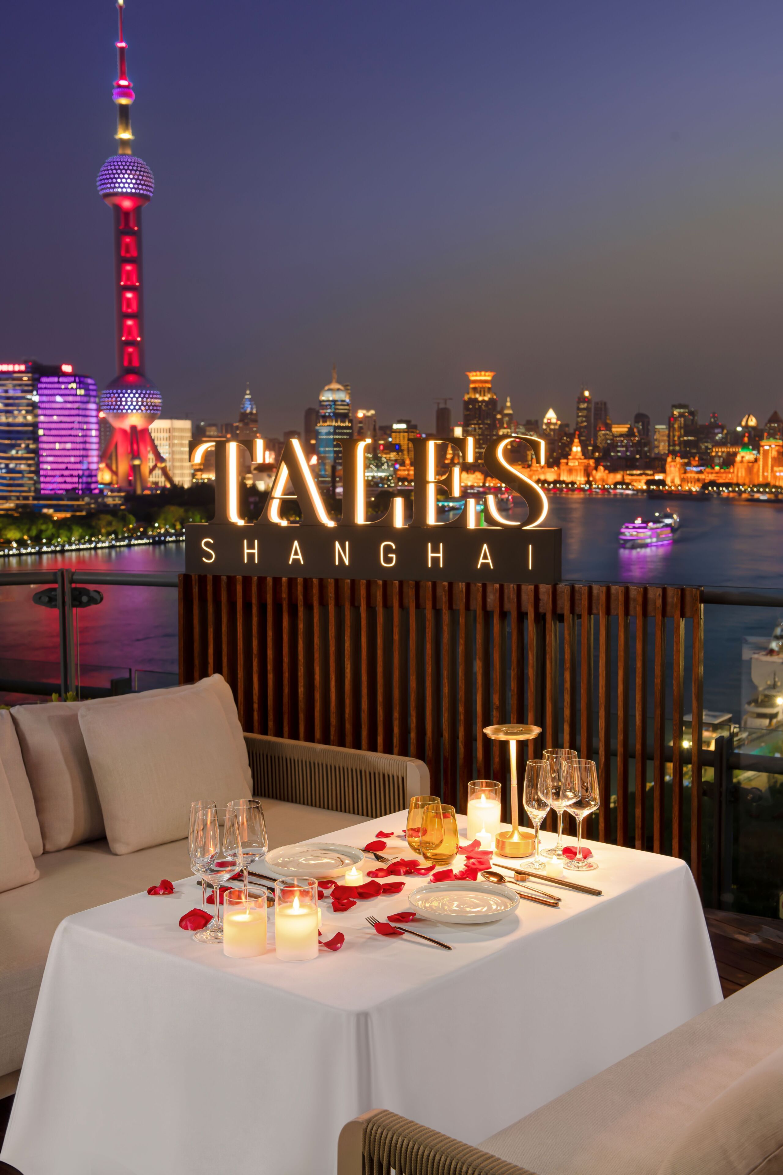 A table set for dining with a city skyline in the background.
